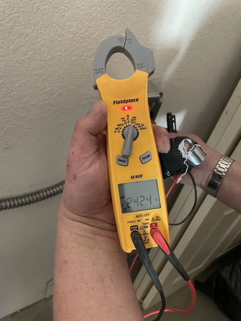Voltage testing with clamp meter during Electrical Installation Services in Russell